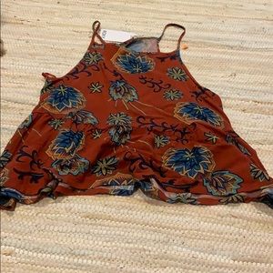 Burgundy patterned tank.